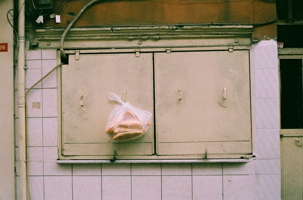 Composition of plastic wrap and packing materials neatly lined up on the desk.